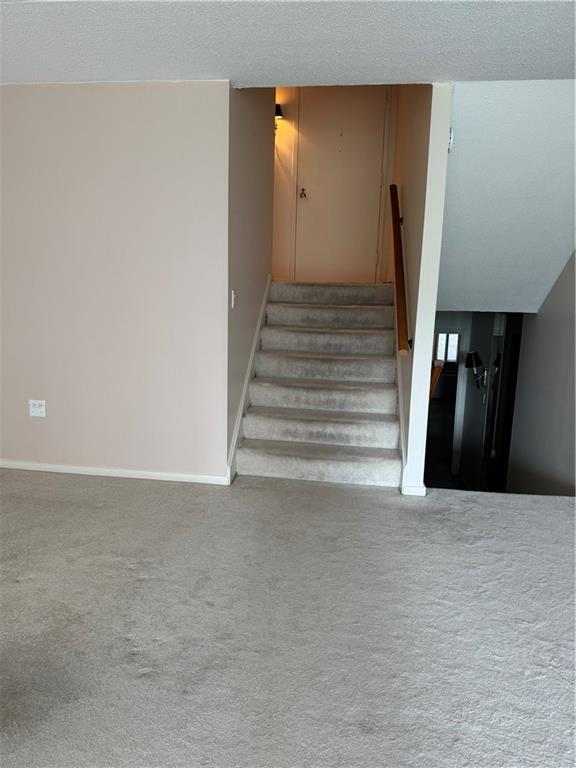 1160 Bower Hill Road, Unit 314A Pittsburgh, PA 15243 - Photo 9 of 24 a view of an empty room with wooden floor and stairs