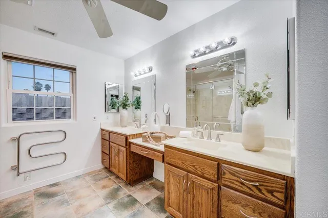 a spacious bathroom with a double vanity sink mirror and double