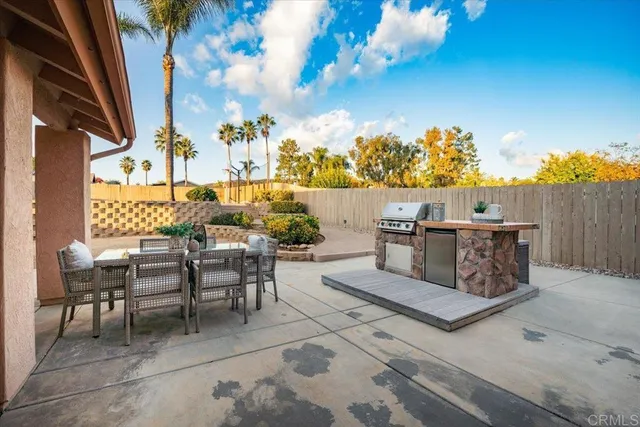 a view of a chairs and table in patio