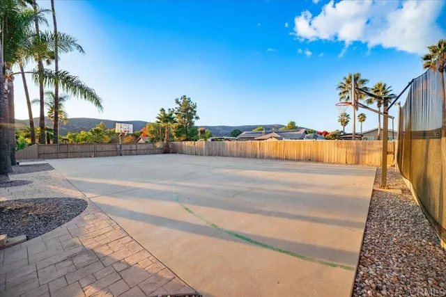 a view of a swimming pool with an outdoor space and seating area