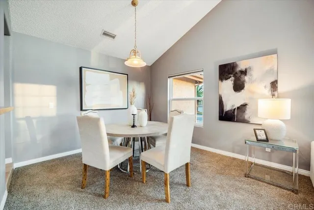 a view of a dining room with furniture