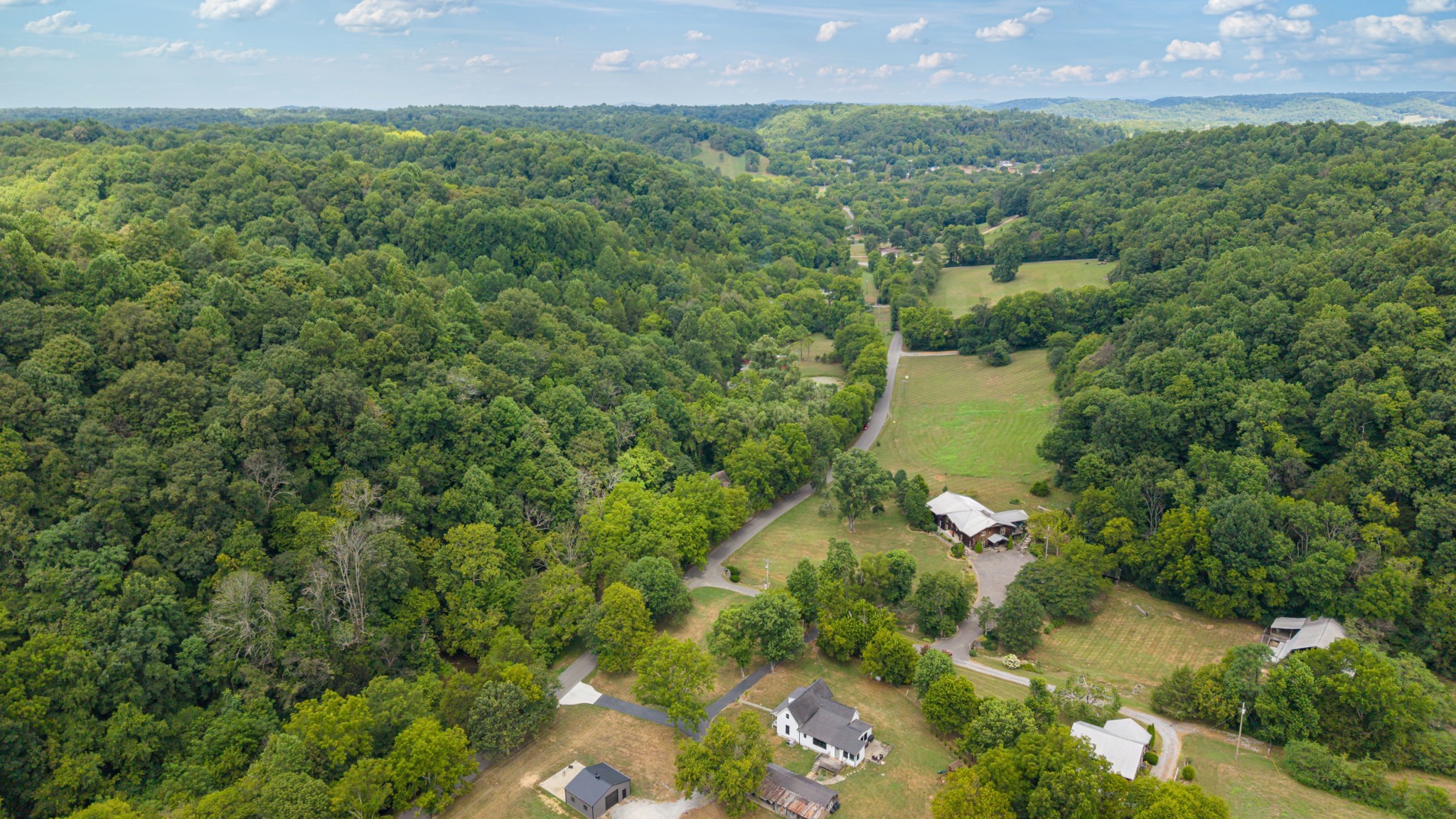 400 Cascade Hollow Road Normandy, TN 37360 - Photo 36 of 56 a view of a garden with a house
