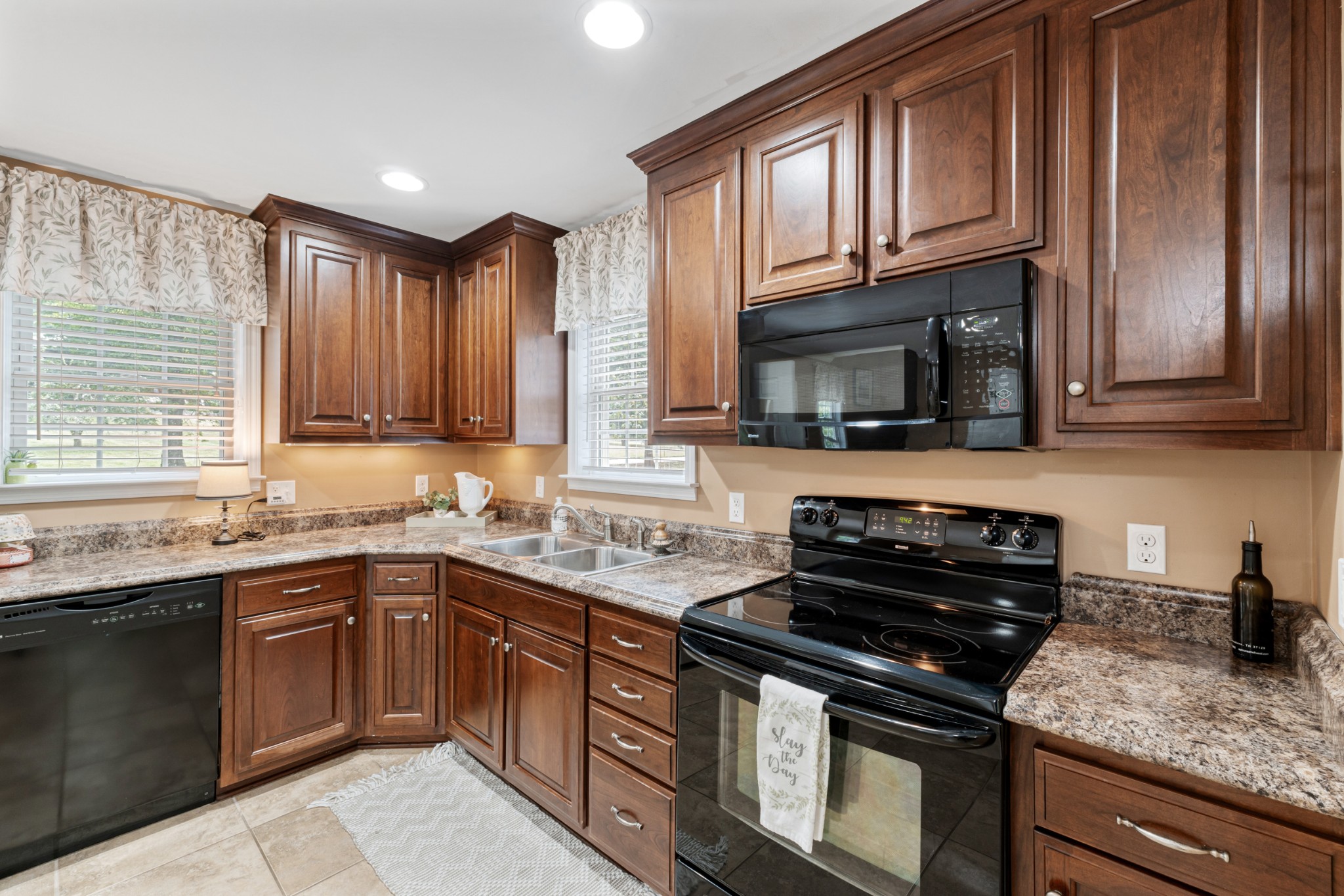 400 Cascade Hollow Road Normandy, TN 37360 - Photo 7 of 56 a kitchen with stainless steel appliances granite countertop a stove sink microwave and cabinets
