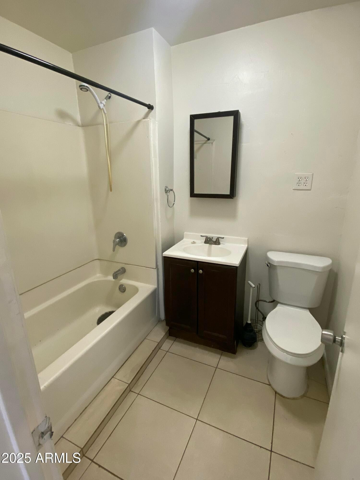 3810 North 9th Place, Unit 1 Phoenix, AZ 85014 - Photo 2 of 7 a bathroom with a sink toilet and shower