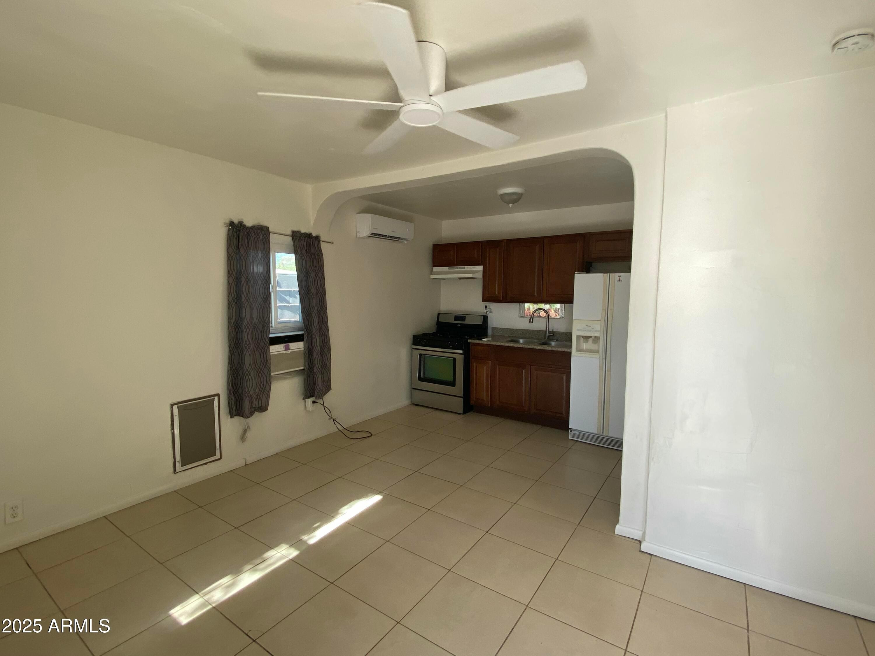 3810 North 9th Place, Unit 1 Phoenix, AZ 85014 - Photo 6 of 7 a view of a kitchen with a sink and a refrigerator