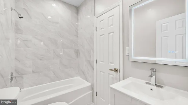 a bathroom with a sink and a bathtub