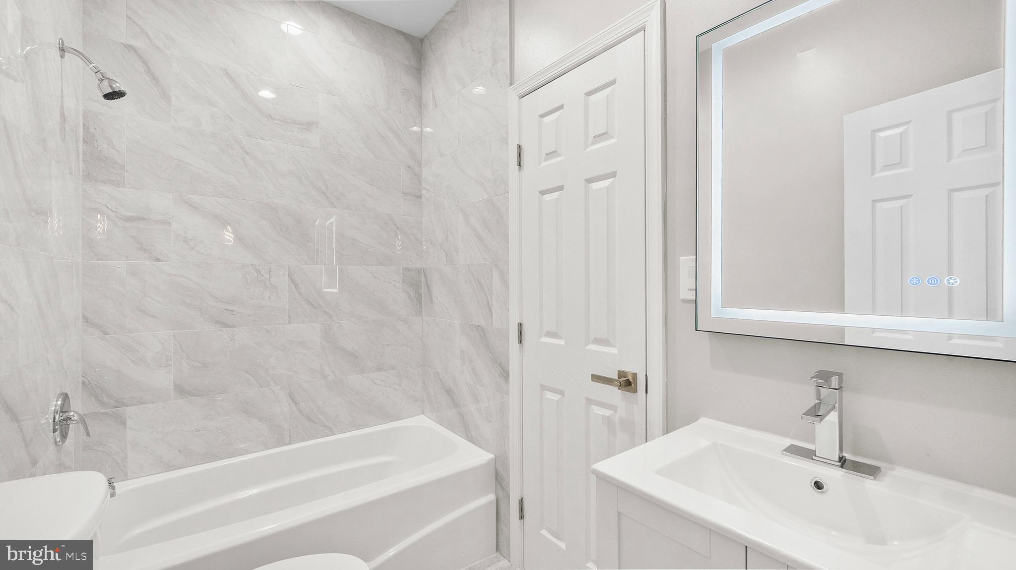 921 Balboa Avenue Capitol Heights, MD 20743 - Photo 12 of 37 a bathroom with a sink and a bathtub