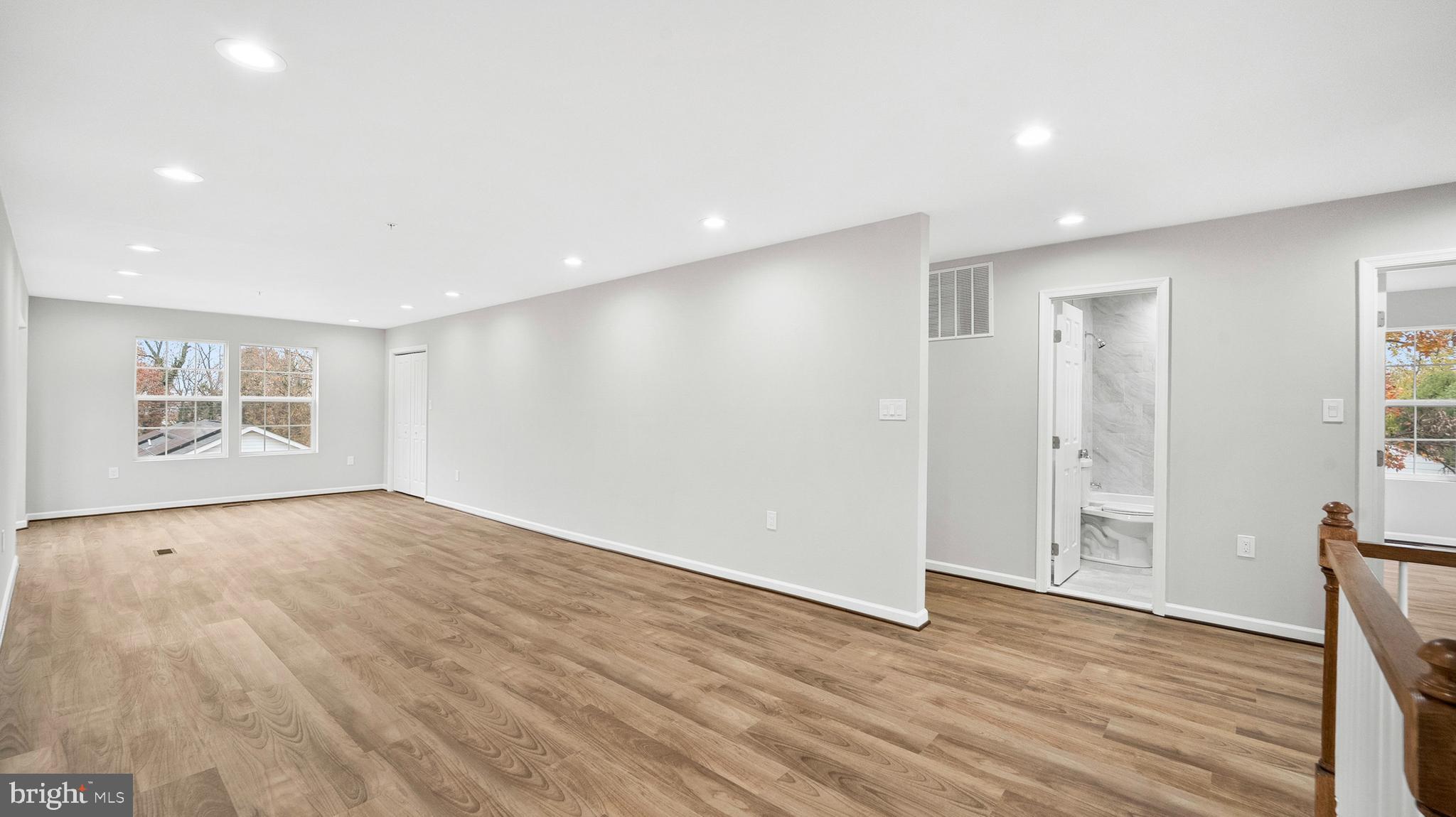 921 Balboa Avenue Capitol Heights, MD 20743 - Photo 15 of 37 a view of an empty room with wooden floor and a window