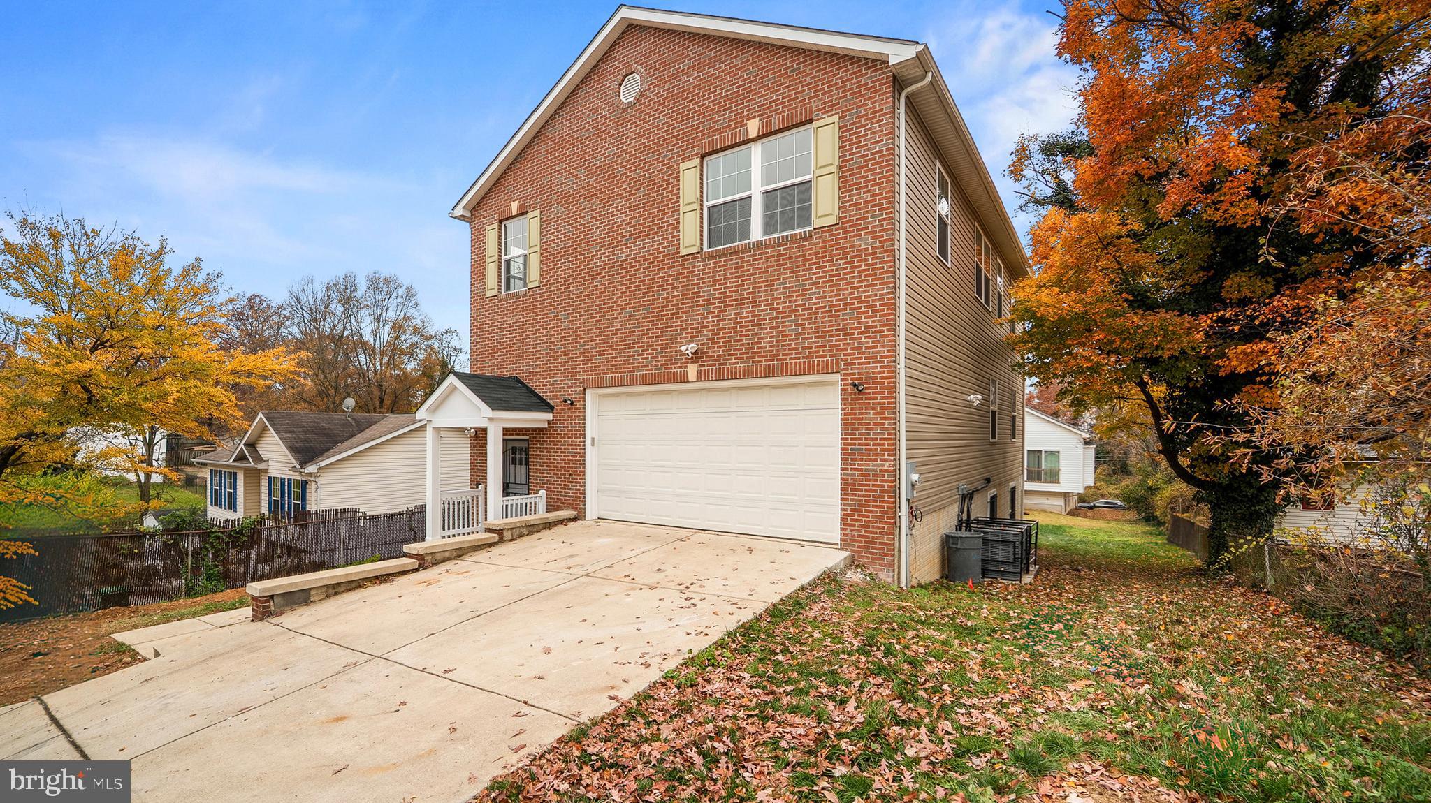 921 Balboa Avenue Capitol Heights, MD 20743 - Photo 2 of 37 a front view of a house with a yard