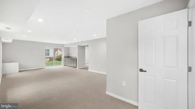 a view of empty room with windows