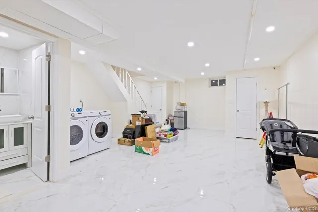 a bathroom with a toilet sink vanity and shower