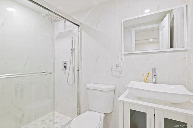 a front view of a house with a yard and pathway