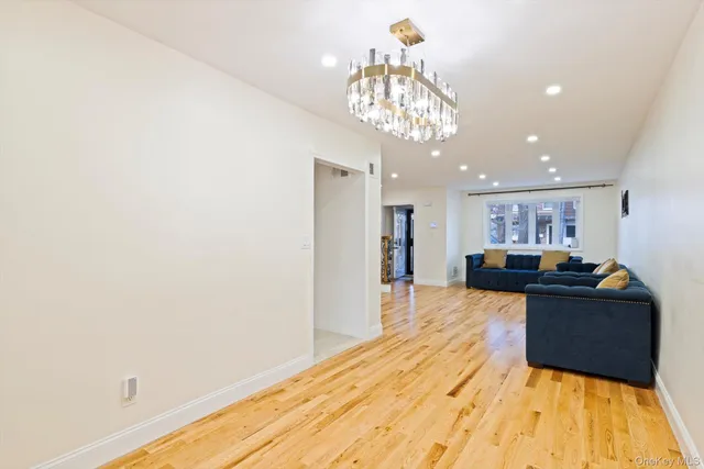 a spacious bedroom with a bed and a couch