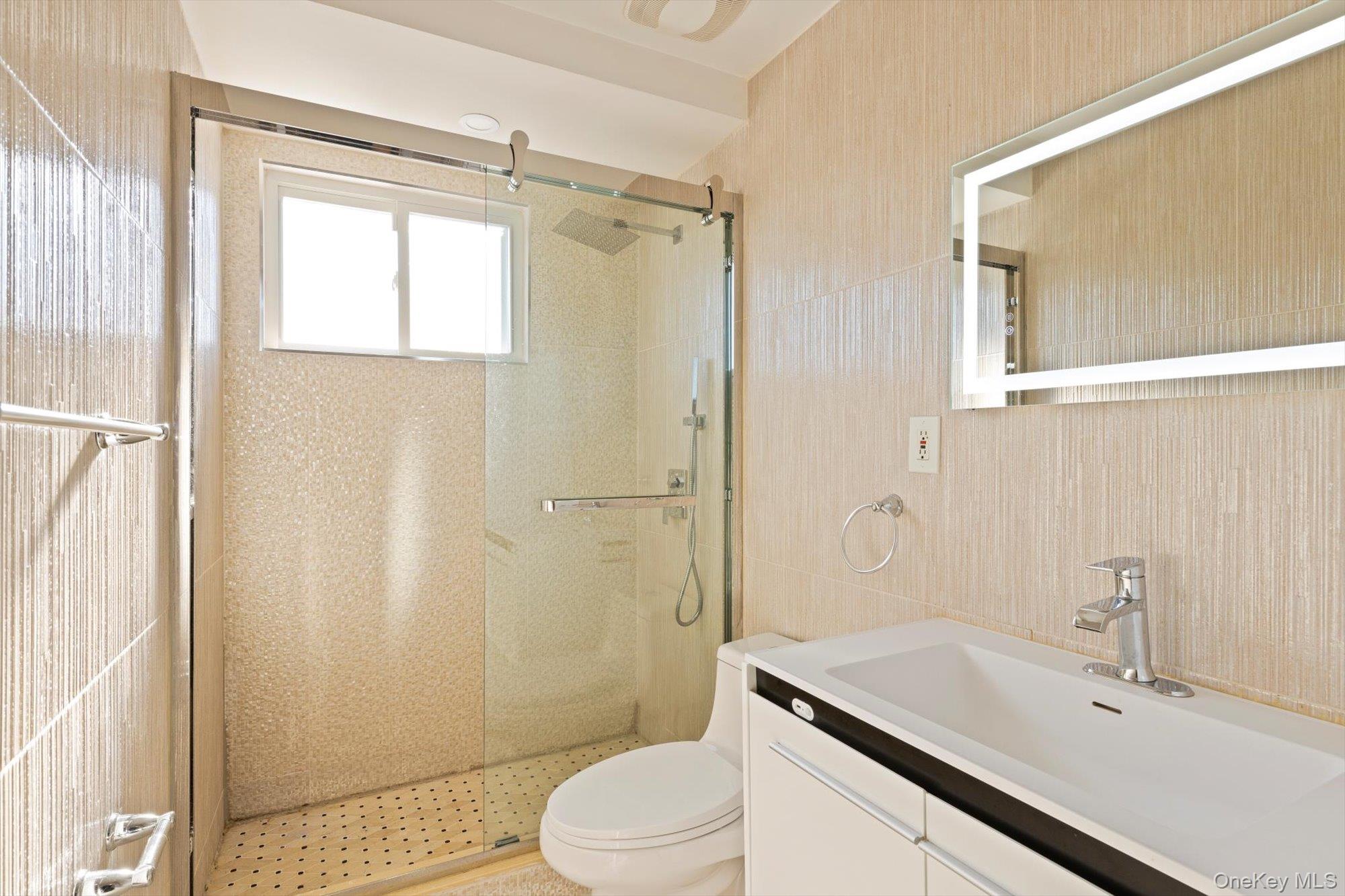 144-14 68th Avenue Queens, NY 11367 - Photo 6 of 15 a bathroom with a sink toilet and shower