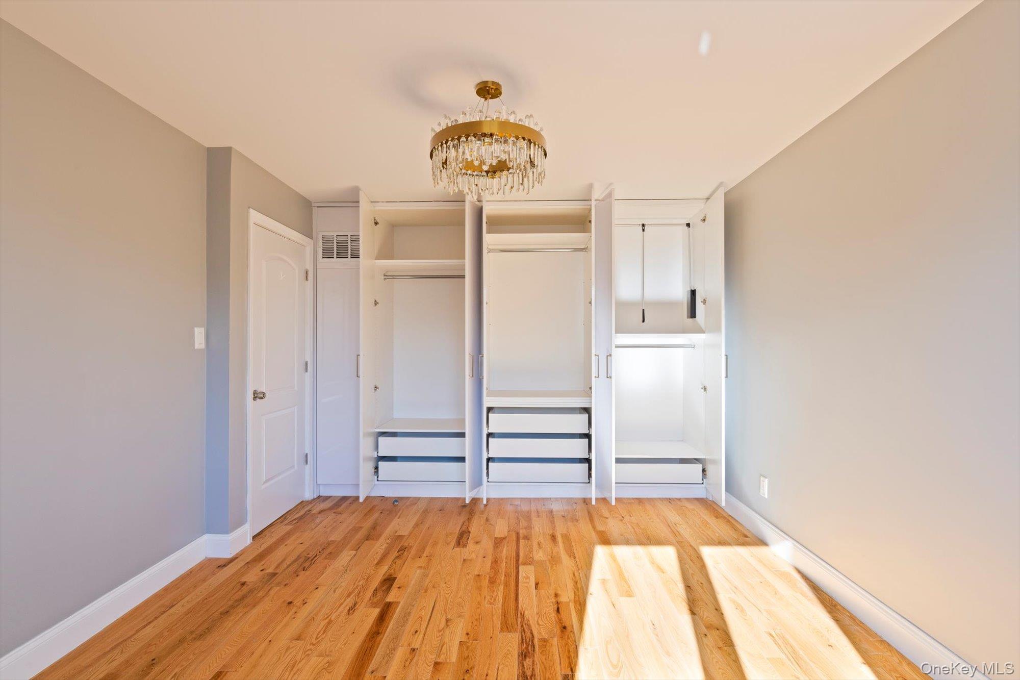 144-14 68th Avenue Queens, NY 11367 - Photo 7 of 15 a view of empty room with wooden floor