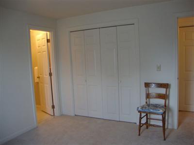 101 Depot Road, Unit 18 Chatham, MA 02633 - Photo 14 of 16 a view of a room that has a dresser and window