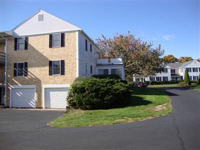 101 Depot Road, Unit 18 Chatham, MA 02633 - Photo 15 of 16 a front view of a house with a garden