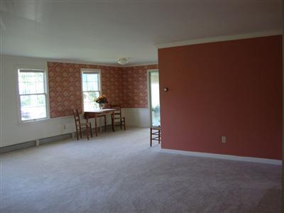 101 Depot Road, Unit 18 Chatham, MA 02633 - Photo 5 of 16 an empty room with furniture and windows
