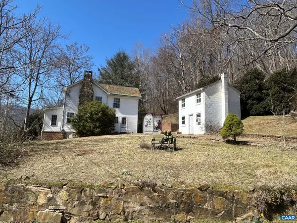 a view of a house with a snow in the yard