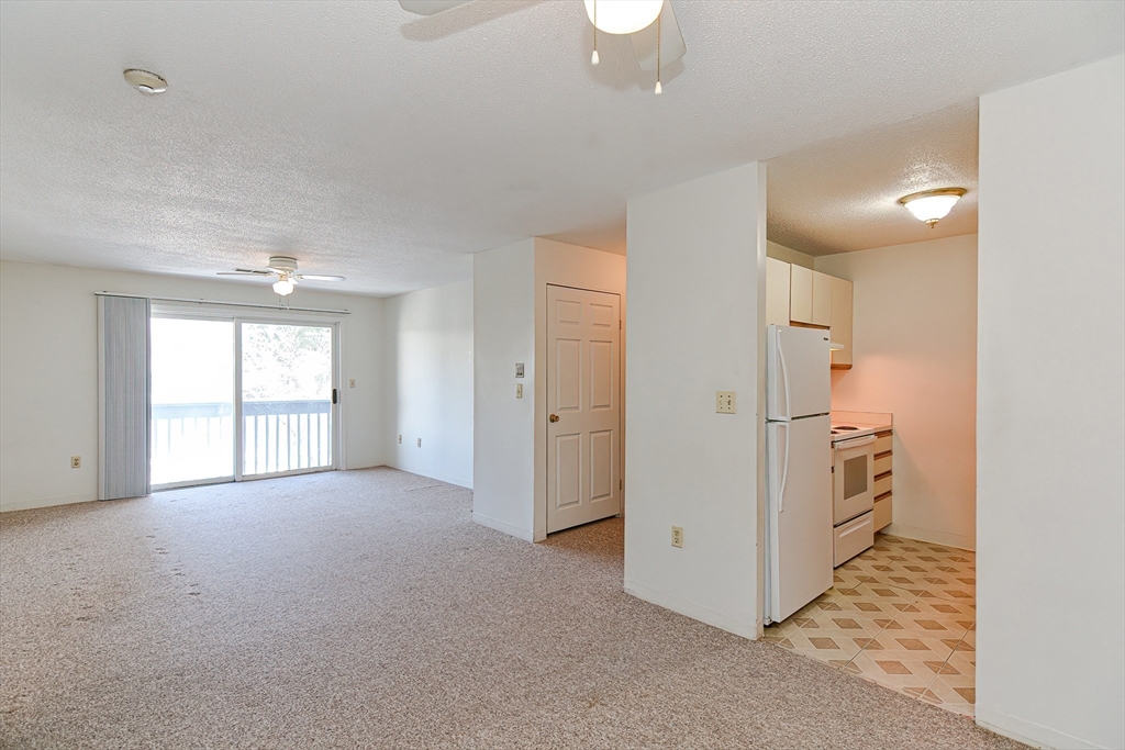 1811 Franklin Crossing Road, Unit 1811 Franklin, MA 02038 - Photo 12 of 31 an empty room with windows and cabinet