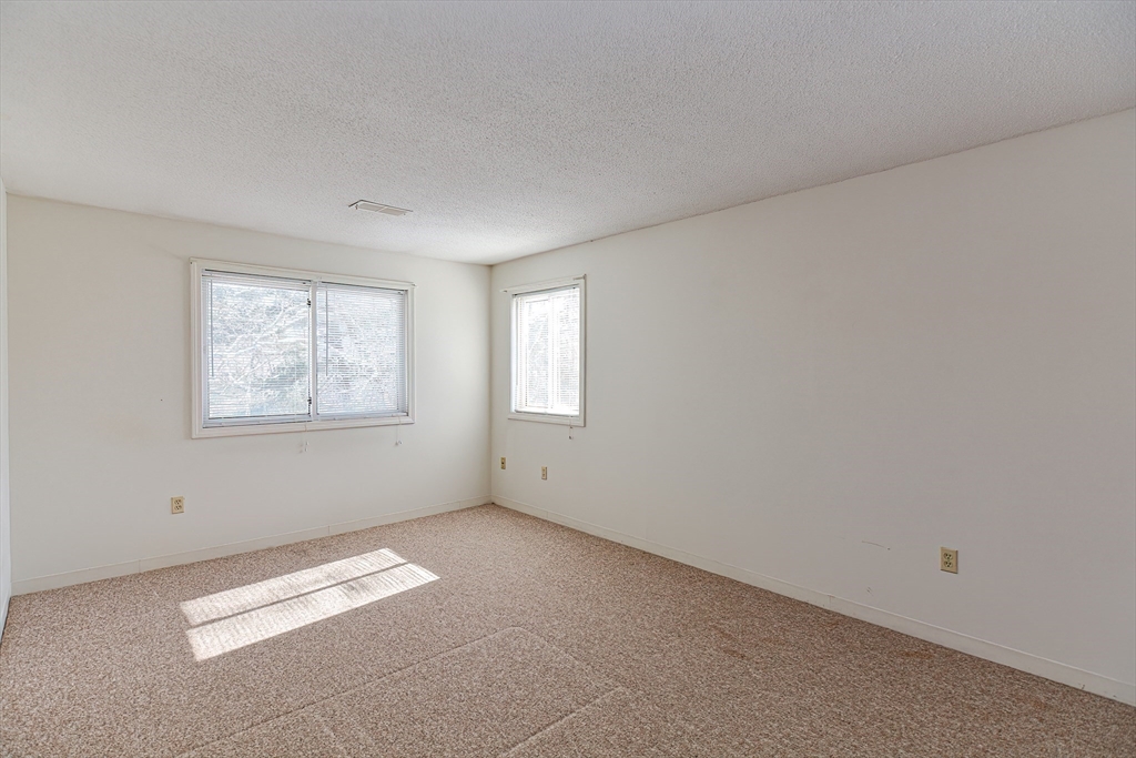 1811 Franklin Crossing Road, Unit 1811 Franklin, MA 02038 - Photo 18 of 31 an empty room with windows