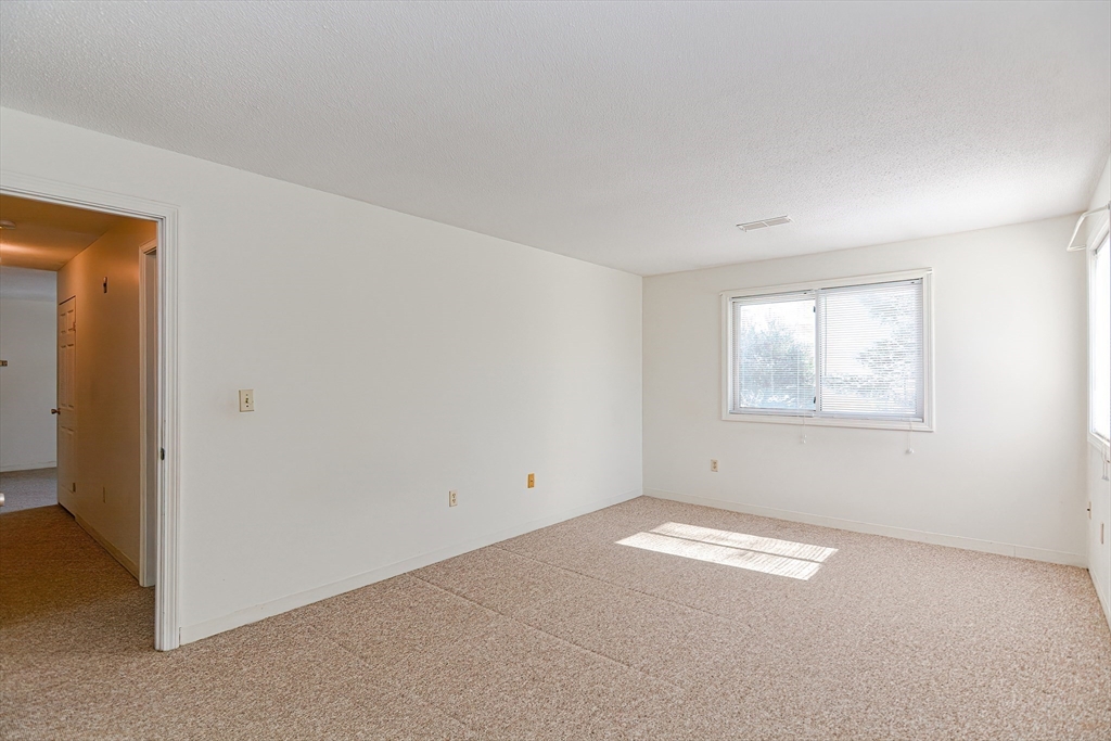 1811 Franklin Crossing Road, Unit 1811 Franklin, MA 02038 - Photo 19 of 31 an empty room with windows