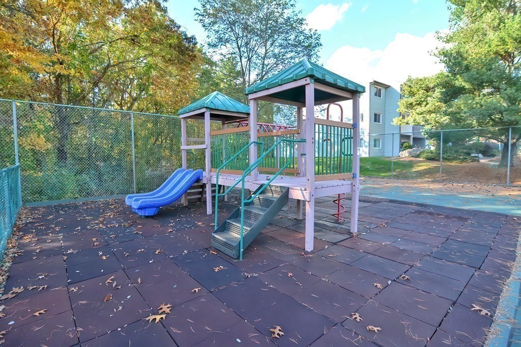 1811 Franklin Crossing Road, Unit 1811 Franklin, MA 02038 - Photo 2 of 31 a view of a chair and tables in the patio