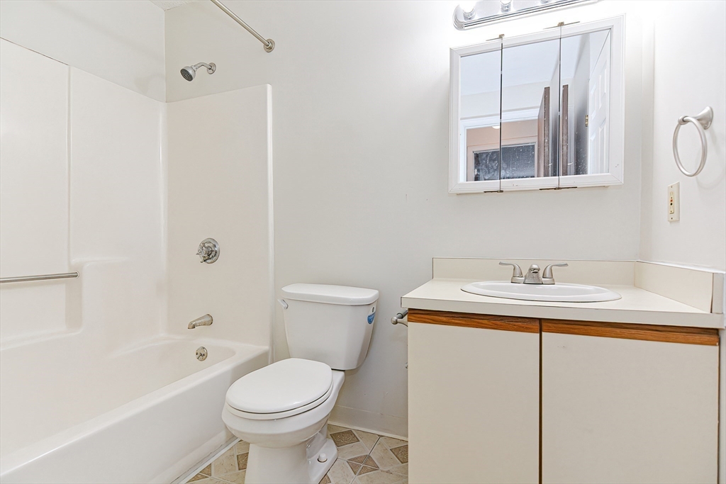 1811 Franklin Crossing Road, Unit 1811 Franklin, MA 02038 - Photo 24 of 31 a bathroom with a sink toilet and shower