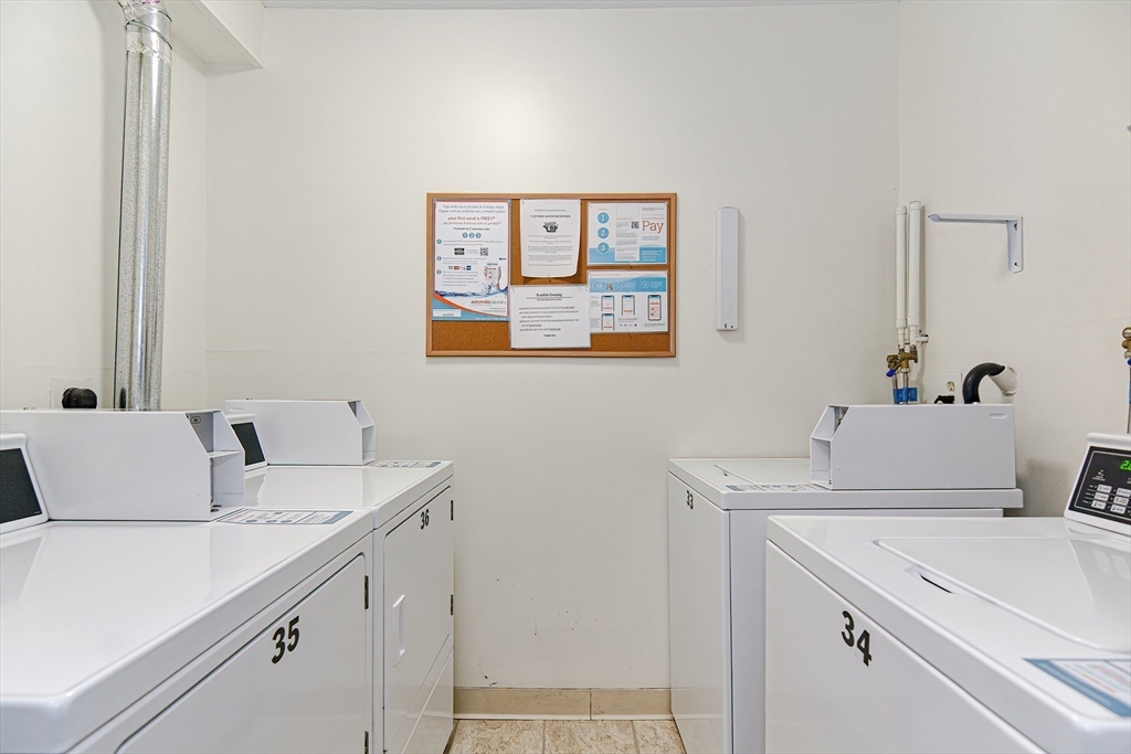 1811 Franklin Crossing Road, Unit 1811 Franklin, MA 02038 - Photo 25 of 31 a bathroom with a sink and a refrigerator