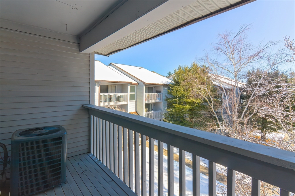 1811 Franklin Crossing Road, Unit 1811 Franklin, MA 02038 - Photo 27 of 31 a view of a balcony with an outdoor space