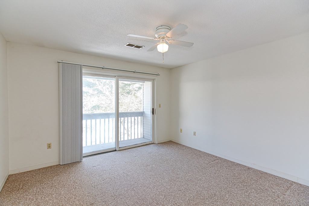 1811 Franklin Crossing Road, Unit 1811 Franklin, MA 02038 - Photo 9 of 31 a view of an empty room with a window