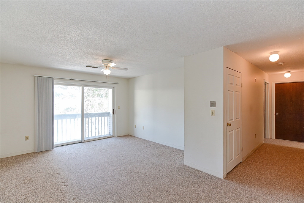 1811 Franklin Crossing Road, Unit 1811 Franklin, MA 02038 - Photo 10 of 31 a view of an empty room with a window