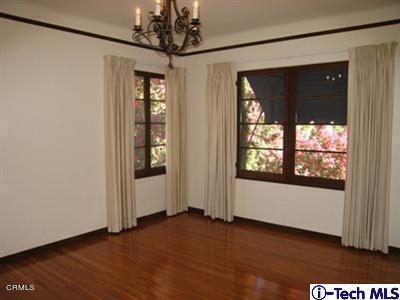 927 Atchison Street Pasadena, CA 91104 - Photo 2 of 13 a view of a room with a large window and wooden floor