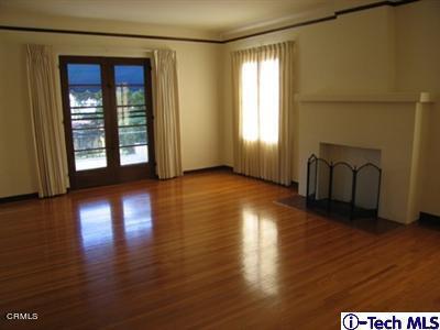 927 Atchison Street Pasadena, CA 91104 - Photo 4 of 13 a view of a room with wooden floor and windows