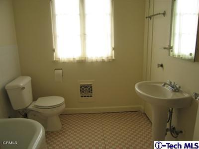 927 Atchison Street Pasadena, CA 91104 - Photo 9 of 13 a bathroom with a sink and a toilet