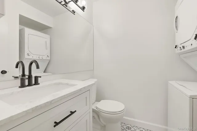 a bathroom with a sink a toilet and mirror