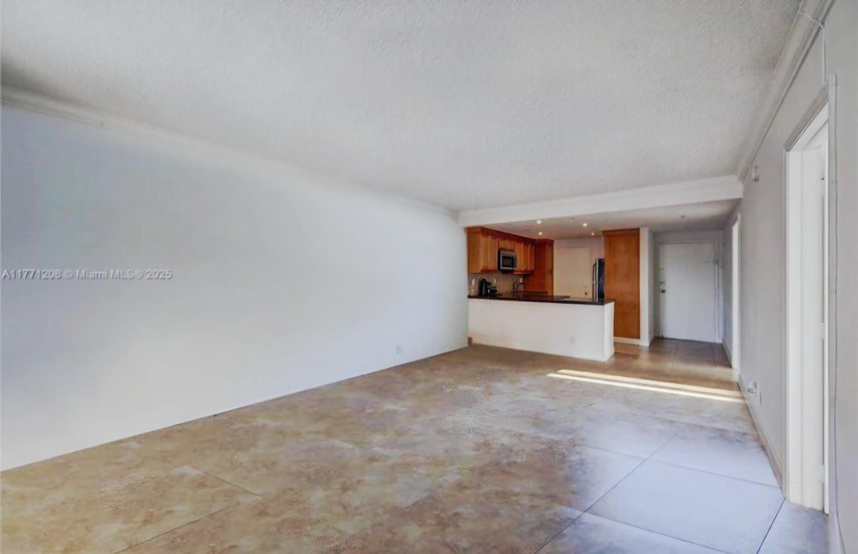 200 South Birch Road, Unit 208 Fort Lauderdale, FL 33316 - Photo 15 of 22 a view of an empty room and window