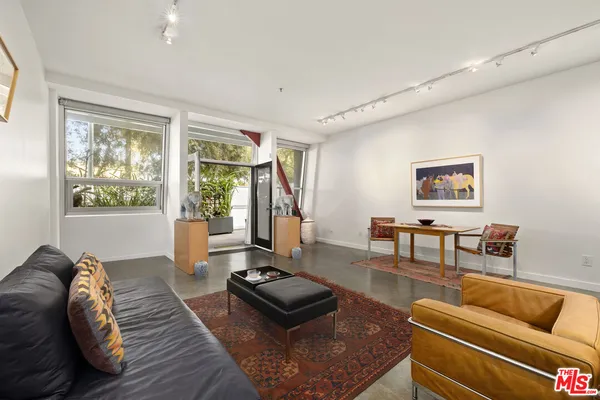 a living room with furniture and a couch