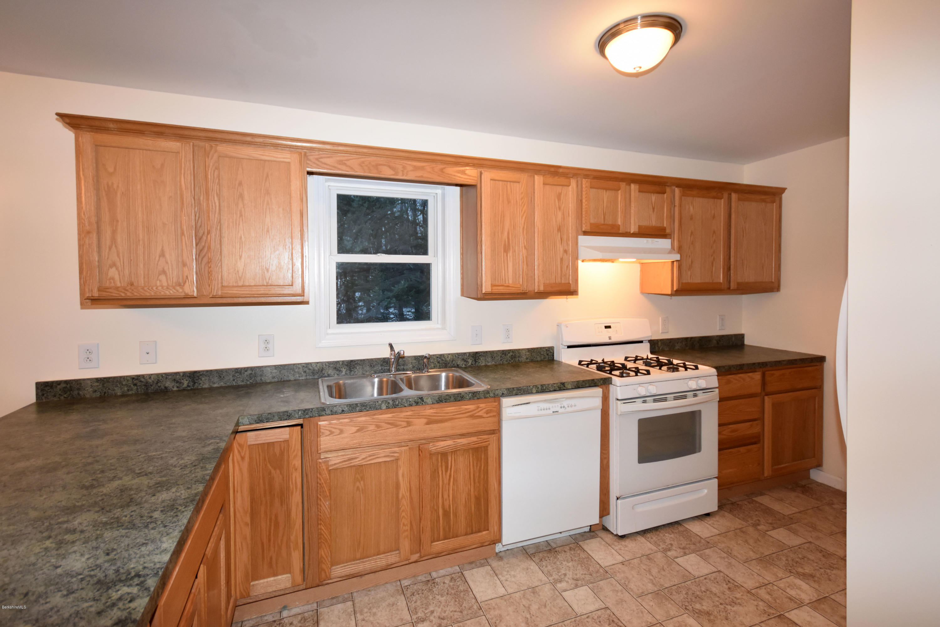 5 Weeks Road Peru, MA 01235 - Photo 14 of 39 a kitchen with stainless steel appliances granite countertop a stove a sink and a microwave