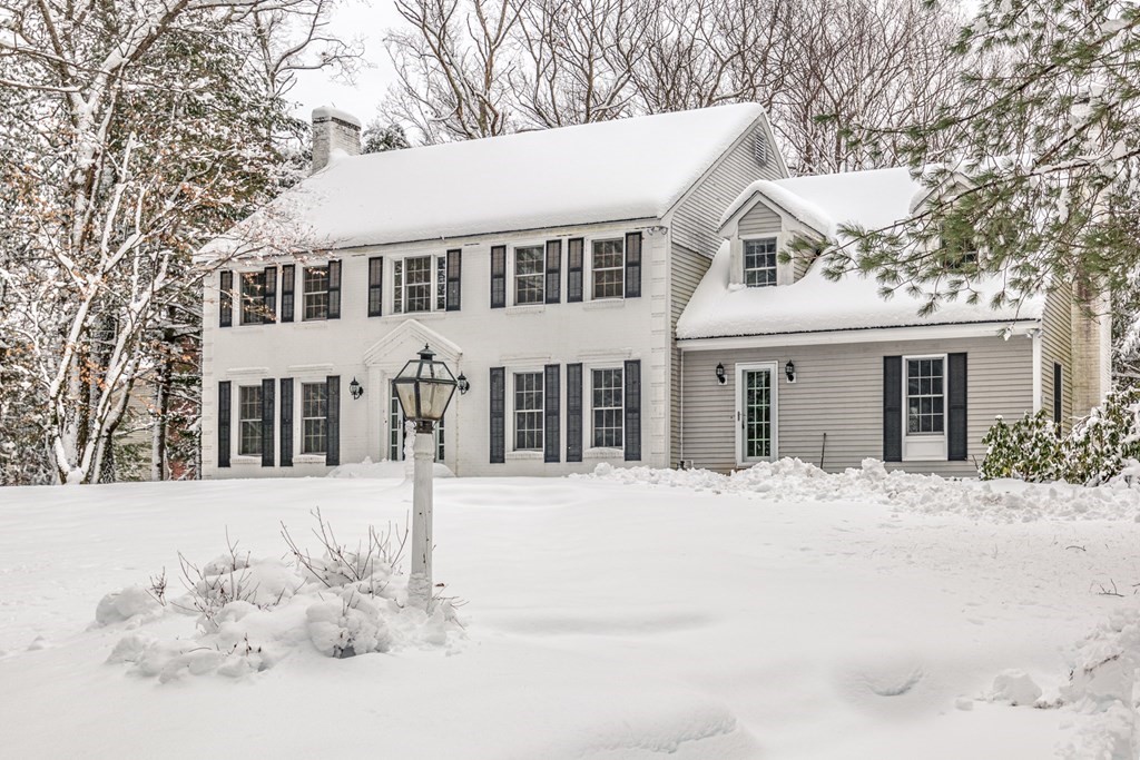 51 Claypit Hill Road Wayland, MA 01778 - Photo 1 of 1 a front view of a house with a yard covered in snow