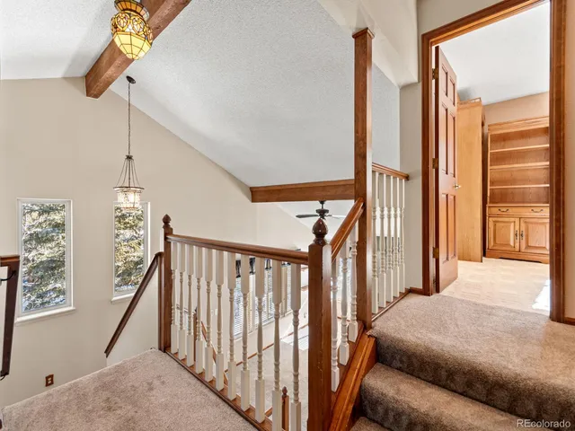 a view of a livingroom with an empty space and a window