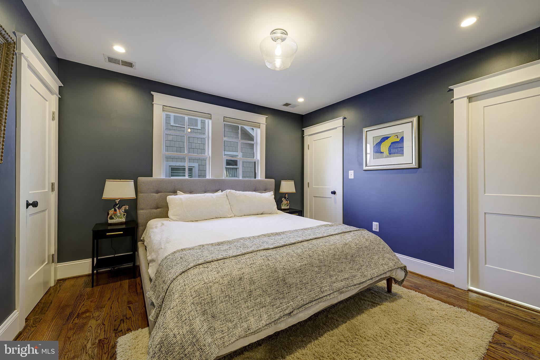 5710 Broad Branch Road Northwest Washington, DC 20015 - Photo 9 of 25 a bedroom with a large bed and a window