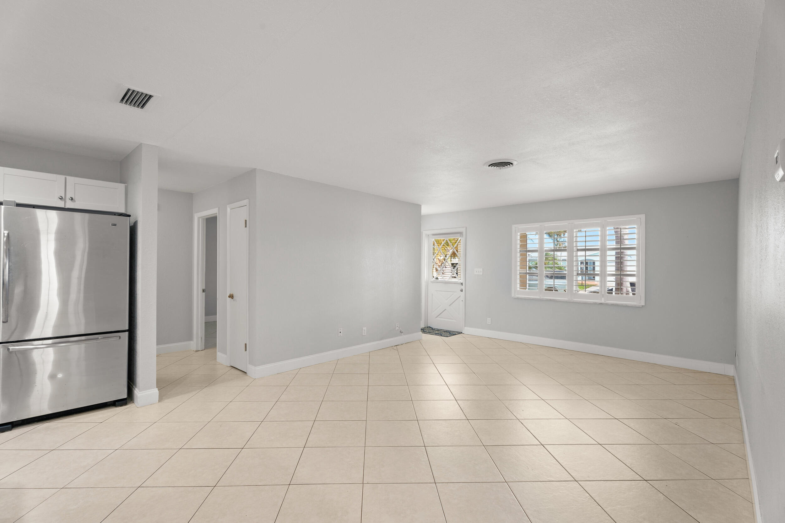 1459 Southwest Seahawk Way Palm City, FL 34990 - Photo 12 of 43 a view of an empty room with a window