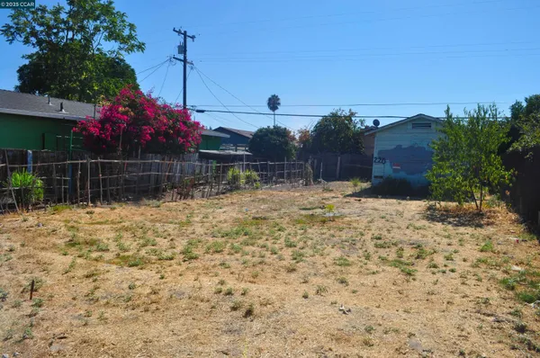 a view of yard with swimming pool and green space