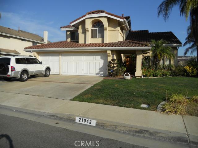21042 Stoddard Wells Road Walnut, CA 91789 - Photo 1 of 1 a front view of a house with a yard