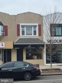 a front view of a house with parking space
