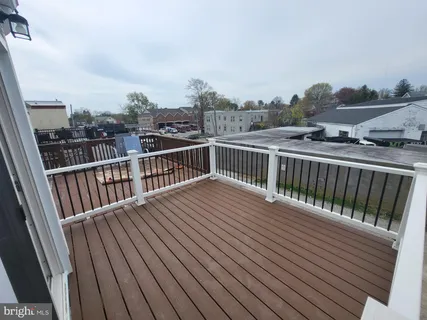 a view of balcony with wooden floor