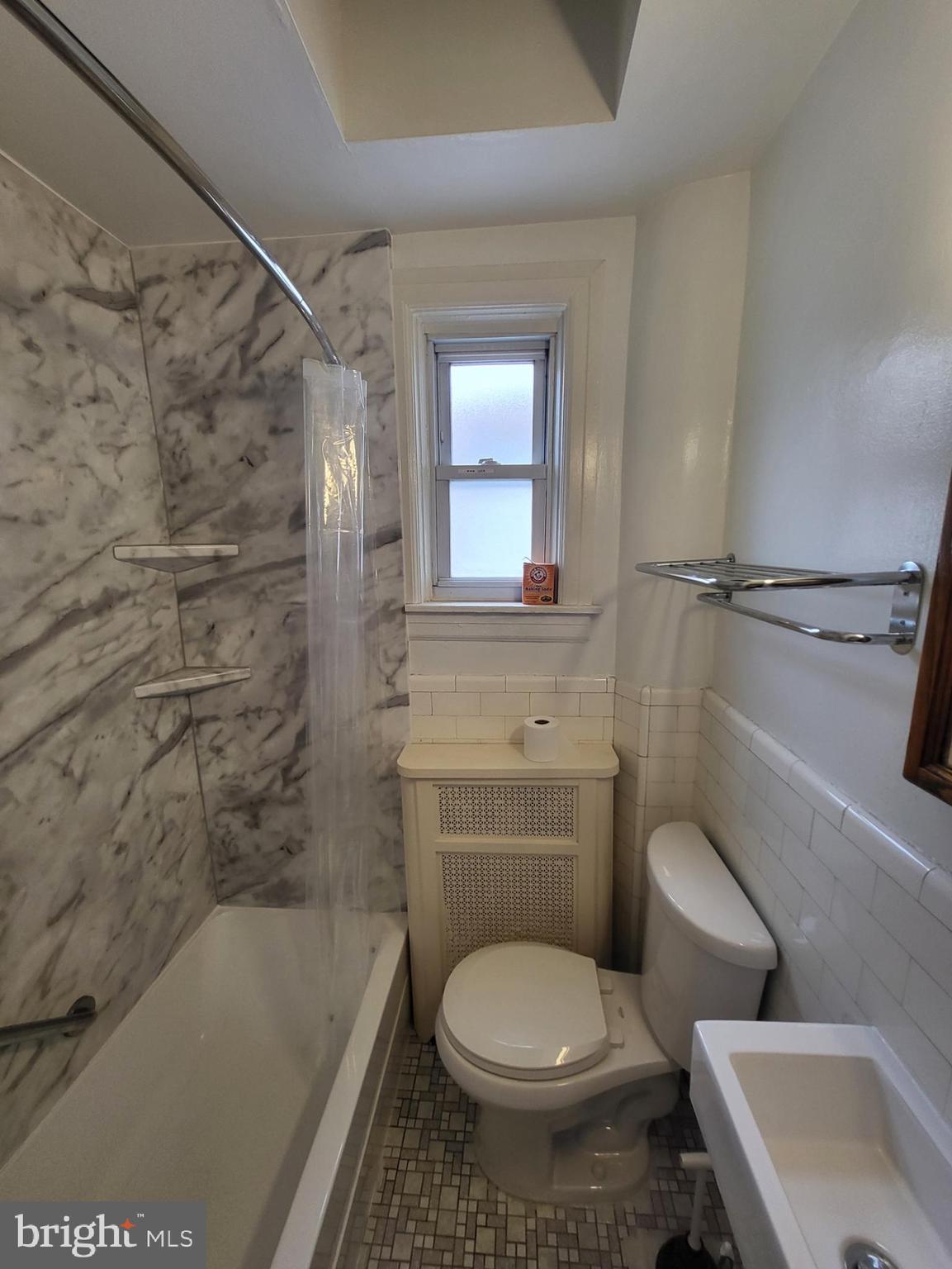 2122 Darby Road Havertown, PA 19083 - Photo 7 of 15 a bathroom with a toilet and a bathtub