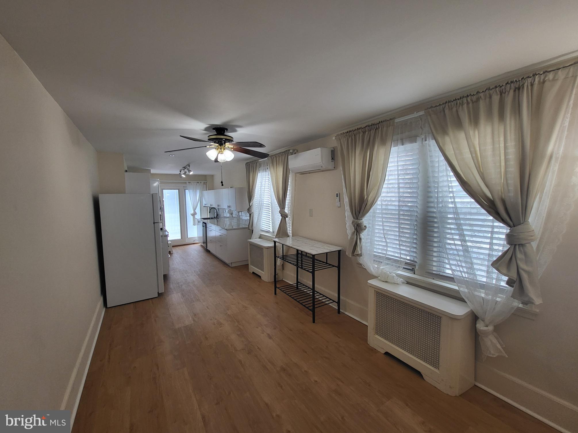 2122 Darby Road Havertown, PA 19083 - Photo 8 of 15 wooden floor in an empty room with a window