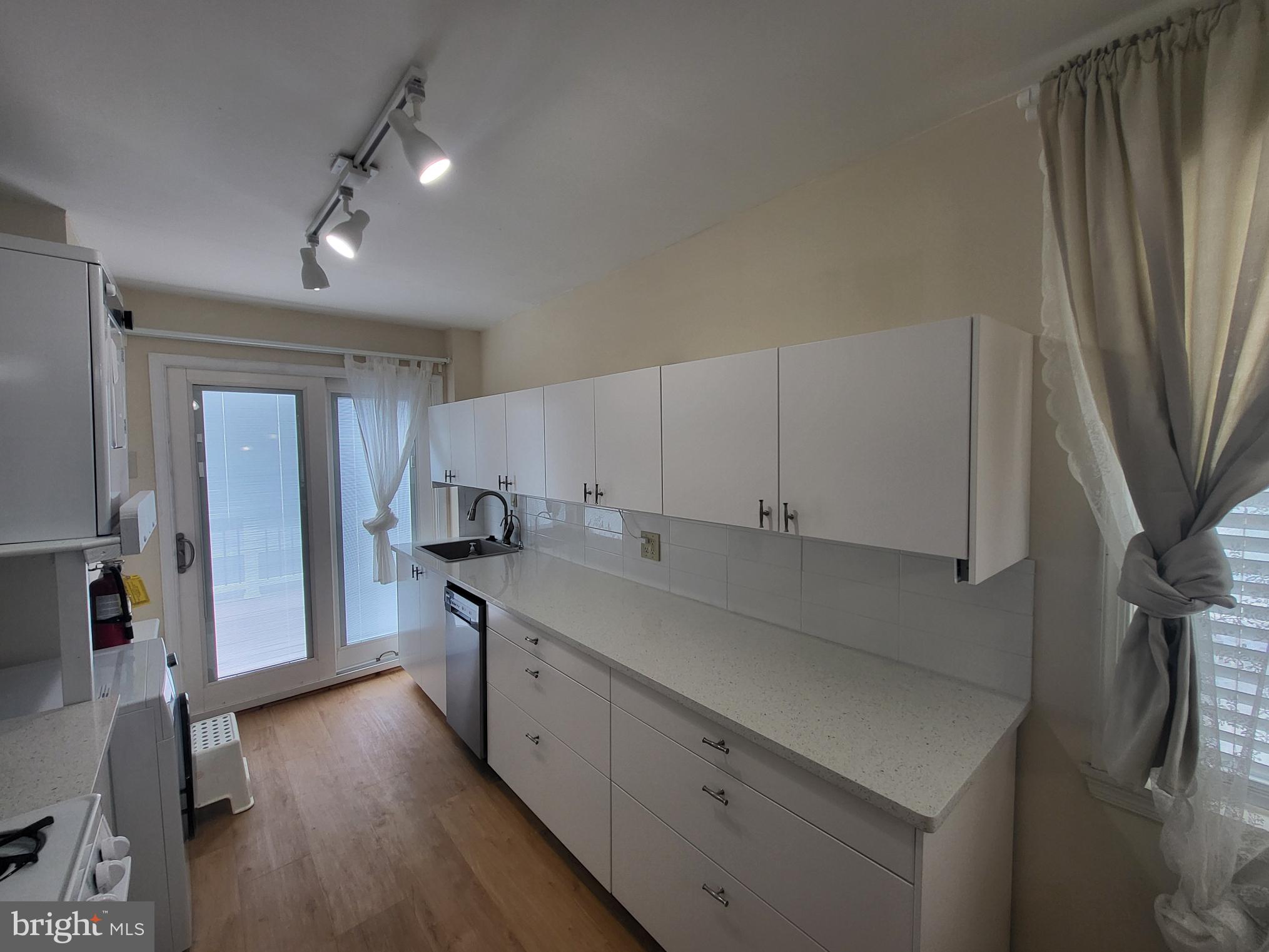 2122 Darby Road Havertown, PA 19083 - Photo 10 of 15 a kitchen with granite countertop a sink stove and refrigerator